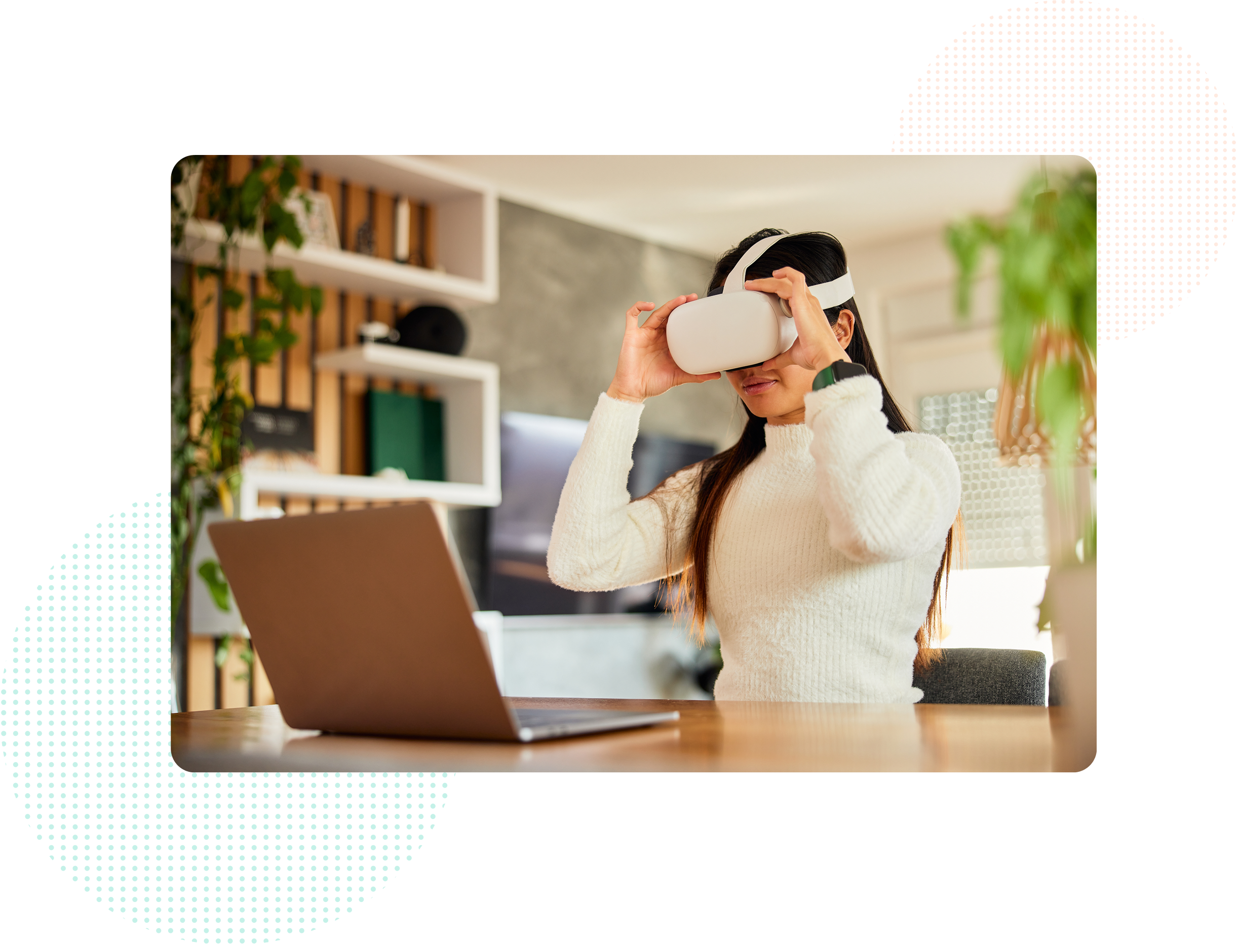 A woman wearing Meta Quest headset, sitting in front of the laptop.